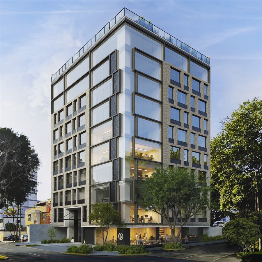 Edificio Armendáriz de esquina con fachada de vidrio y ladrillo